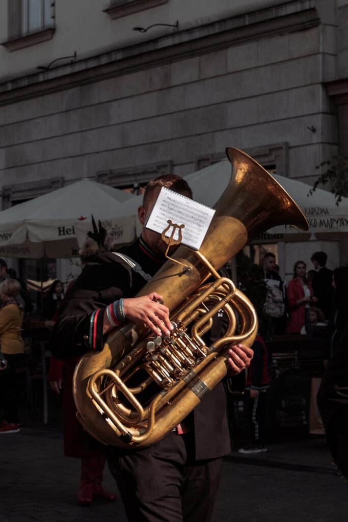 Man Playing A Brown Wind Musical Instrument